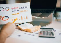 Laptop displaying investment performance charts